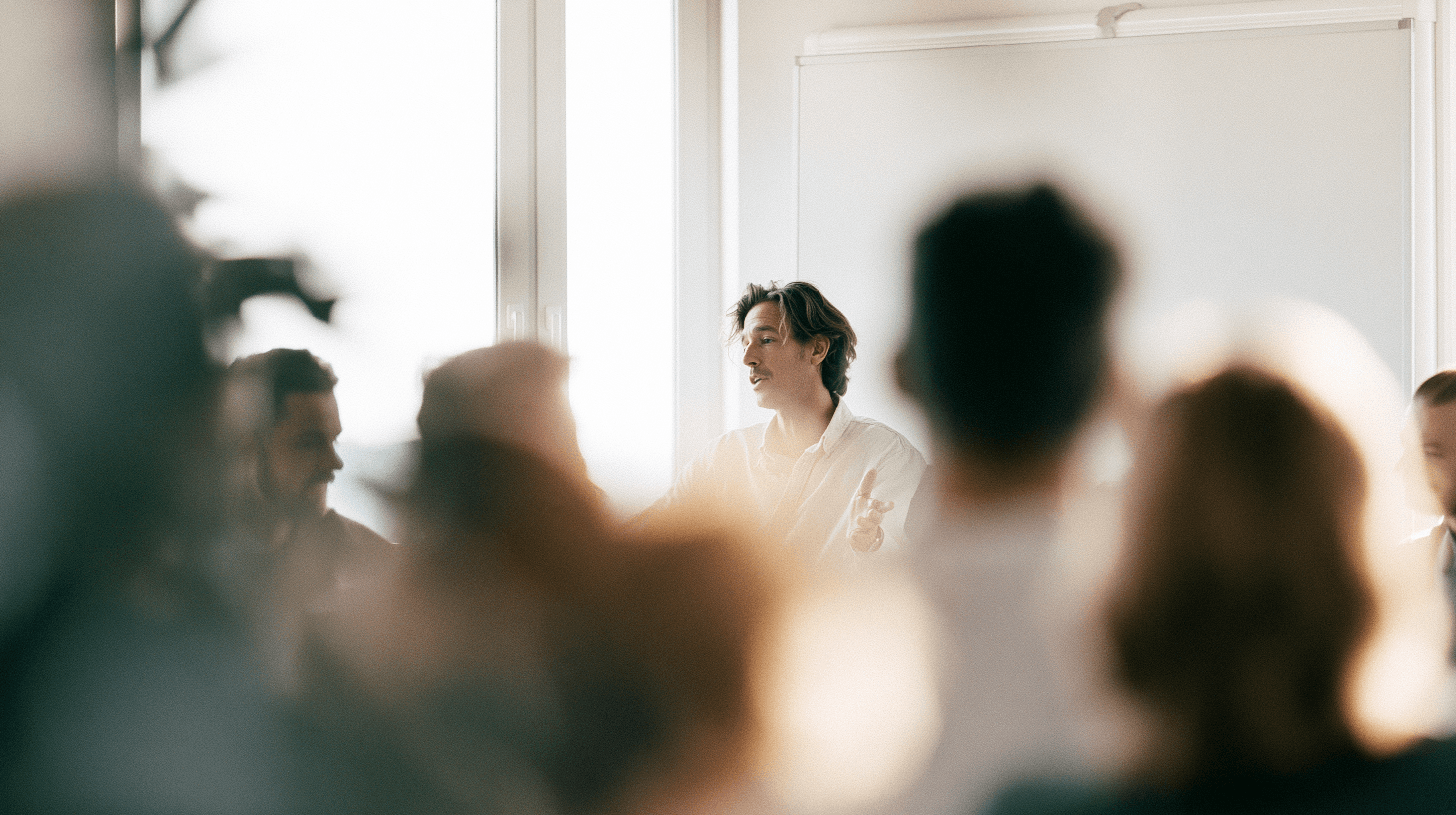 A focused team discussing a high-stakes fundraising conversation